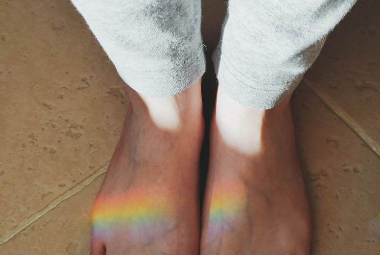 High angle view of a rainbow reflected over feet