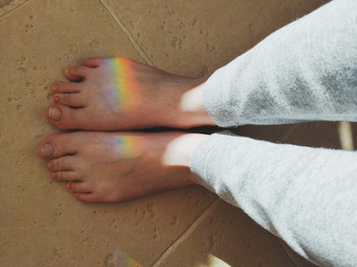 High angle view of a rainbow reflected over feet
