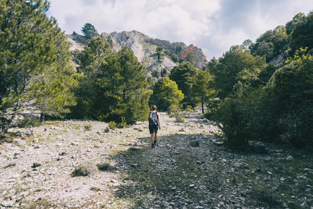 woman hiking on a mountain path in catalonia