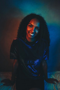 Artistic portrait with color lights of a young woman