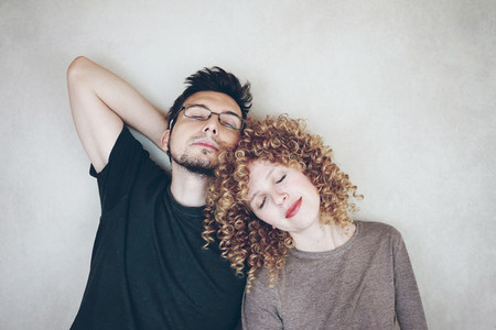 Portrait of a natural caucasian couple of young woman with curly