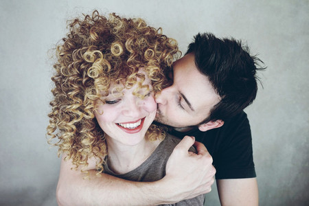 Portrait of a natural caucasian couple of young woman with curly