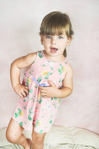 Young little and funny girl in a studio shot