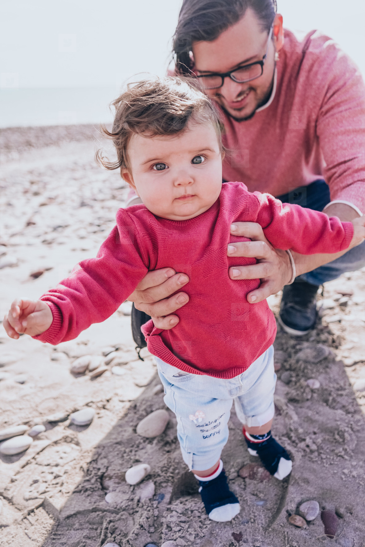 Young dad have a great day at the beach with his dauther