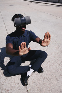 Young man wearing VR glasses