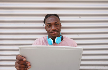 Young man working with his laptop