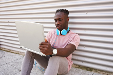 Young man working with his laptop