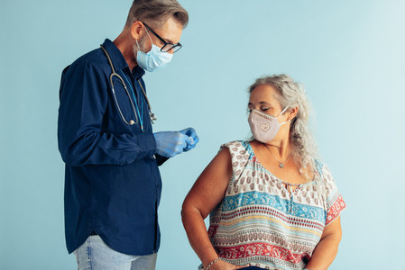 Senior woman getting corona virus vaccine
