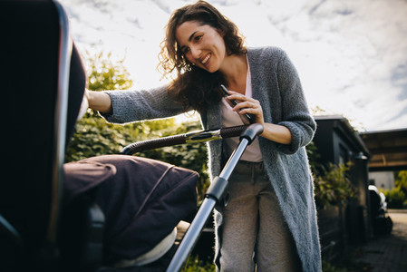 Happy mother with stroller