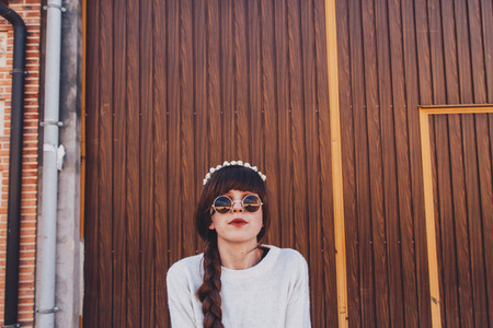 Young brunette woman with retro and hippy style