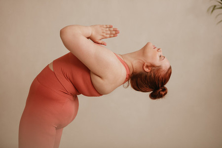 Healthy woman doing yoga exercise