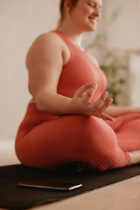 Meditating in Padmasana at fitness studio