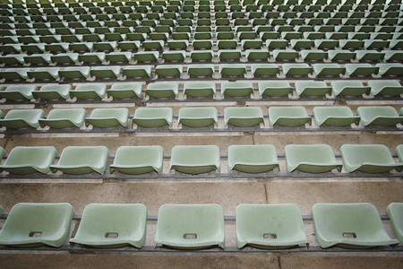 Rows of green seats in stadium