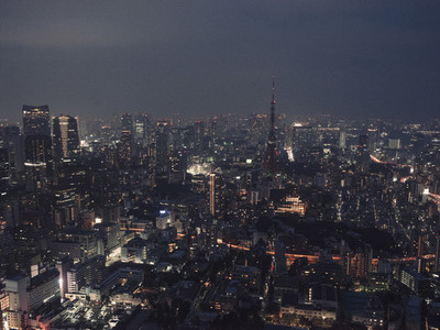Illuminated highrise buildings and cityscape at night Tokyo Japan
