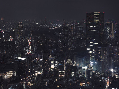 Illuminated buildings and cityscape at night Tokyo Japan