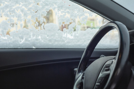 Inside of car with snow covered window