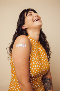 Woman smiling after getting immunity vaccine