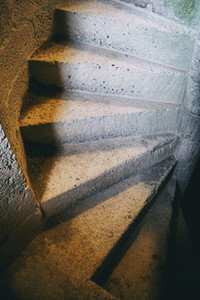 view of a spiral staircase made of old stone
