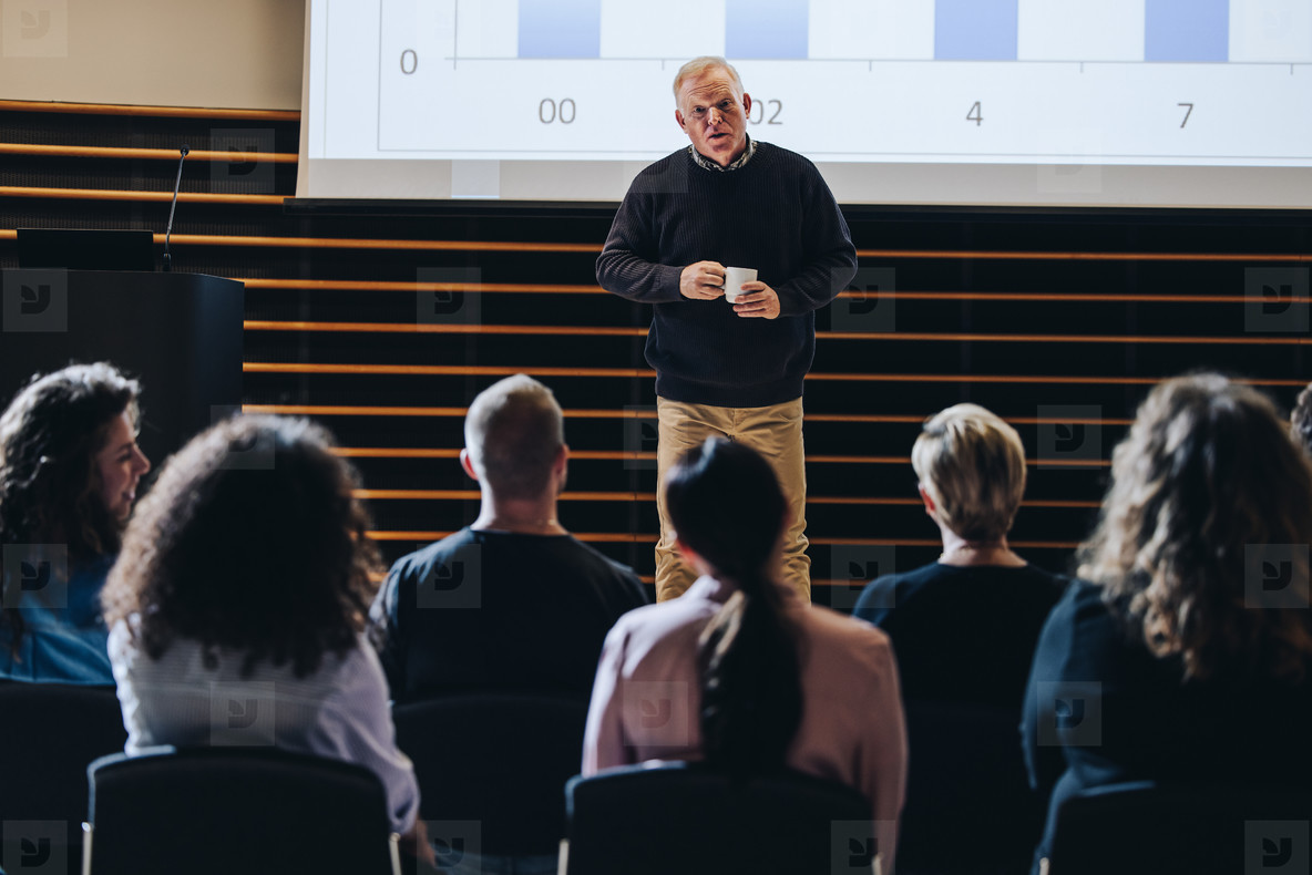 Speaker giving a motivational speech in corporate event