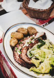 Traditional portuguese dish with grilled octopus  boiled potato and cabbage