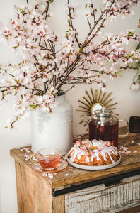 Gluten free bundt cake and tea under almond blooming branches