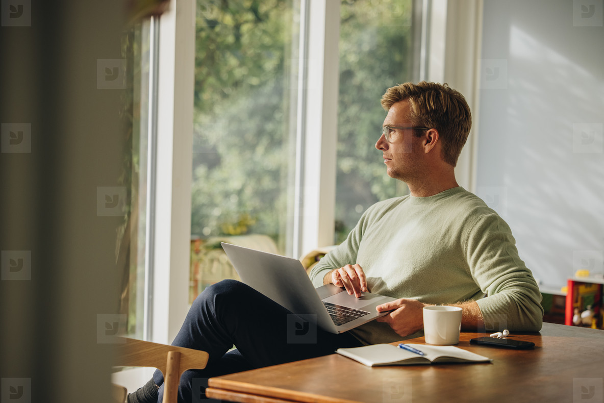 Man sitting with laptop