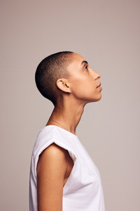 Woman in casuals with shaved head