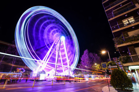 Ferris wheel at night at the fair in Granada