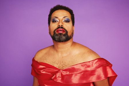 Elegant drag queen on purple background