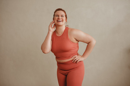 Confident plus size woman in sports clothing