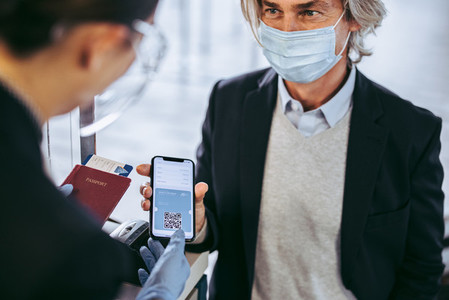 Businessman check in at airport with negative coronavirus test r