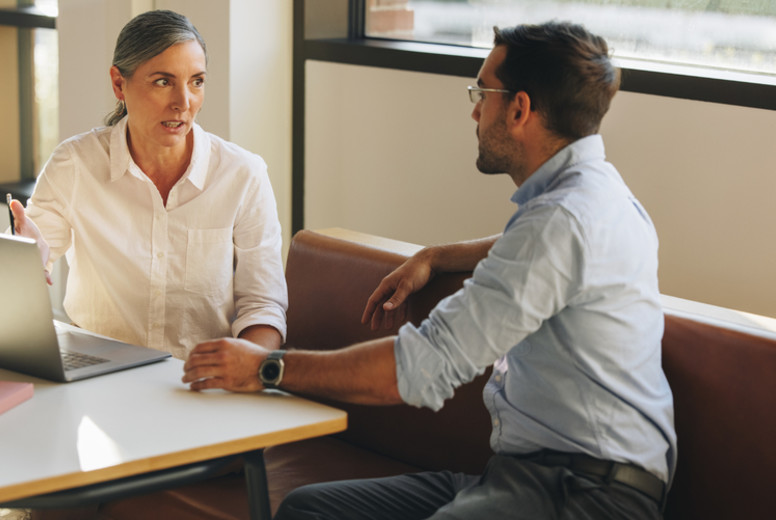Woman sharing project details with business partner