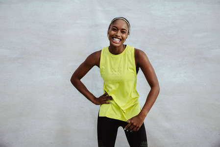 Smiling african woman in sportswear