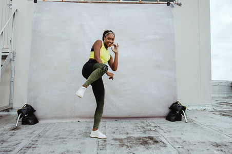African athlete woman exercising on rooftop