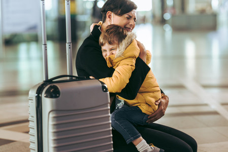 Mother getting emotional while meeting her child at airport
