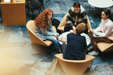 Young students discussing studies in campus