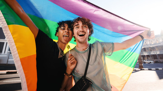 Non conforming men celebrating gay pride outdoors