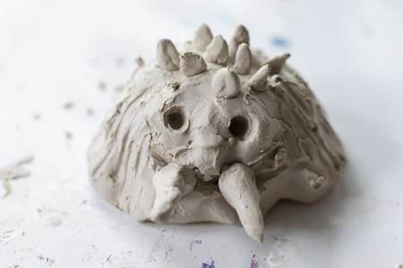 Close up cute monster molded in clay