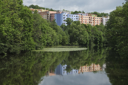 Pastel apartment buildings behind idyllic lake Czechoslovakia