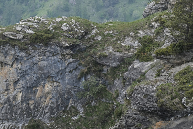 Man standing at the edge of rugged mountain cliff #Italy