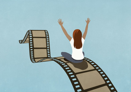 Excited woman riding movie film reel