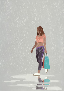 Wet woman with shopping bags walking in rain