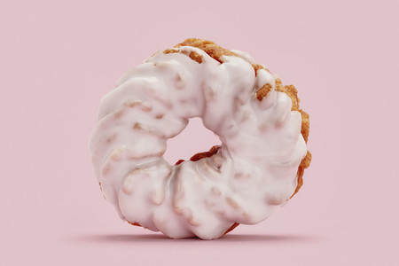 Close up frosted pink cruller donut