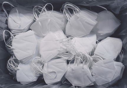 Abundance of white disposable protective face masks