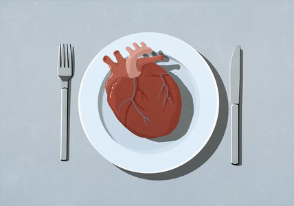 Human heart organ on dinner plate