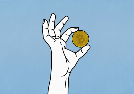 Close up hand holding Bitcoin on blue background