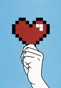 Close up hand holding pixelated heart