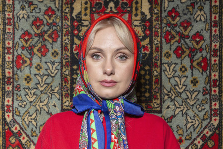 Portrait beautiful woman in colorful babushka