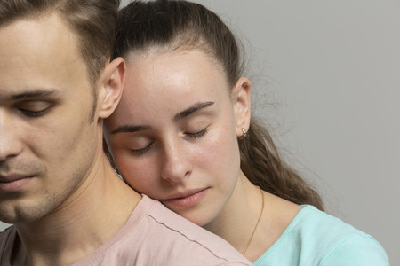Close up serene tender young couple with eyes closed
