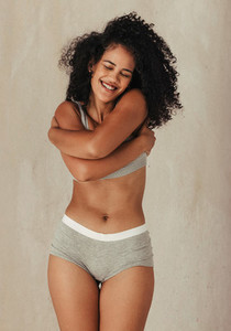 African American model embracing her natural body